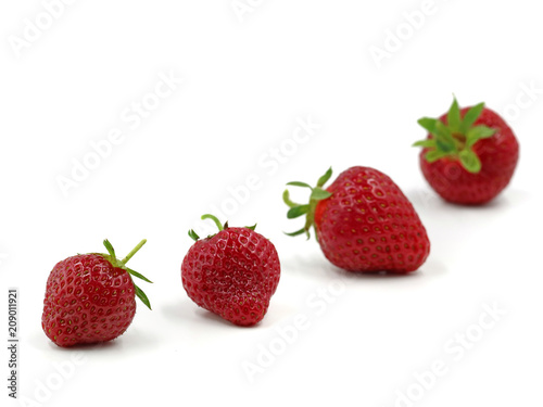 Fresh strawberrys with depth of field isolated on white background