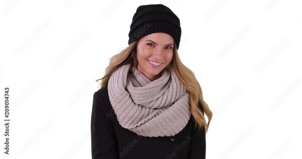 Smiling portrait of woman in cozy hat and scarf in studio with copyspace, Cheerful female dressed for fall or winter on white background with copy space, 4k Smiling portrait of woman in cozy hat and scarf in studio with copyspace, Cheerful female dressed for fall or winter on white background with copy space, 4k