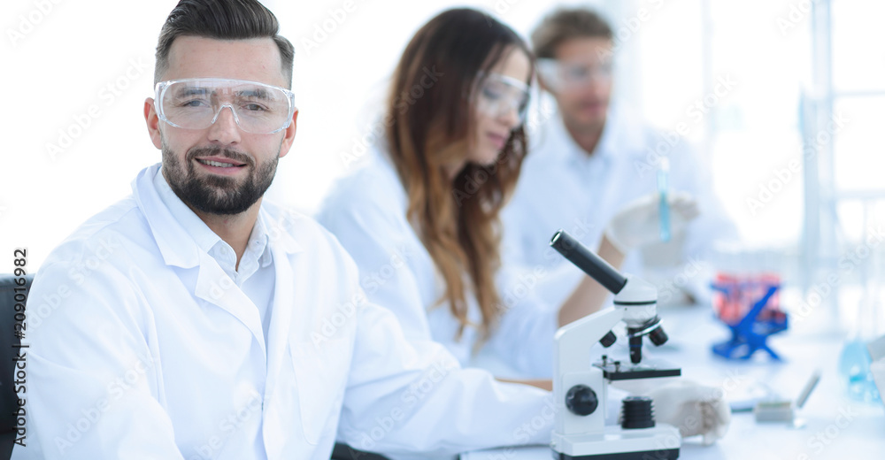 microbiologist and his colleagues are sitting in a modern laboratory microbiologist and his colleagues are sitting in a modern laboratory