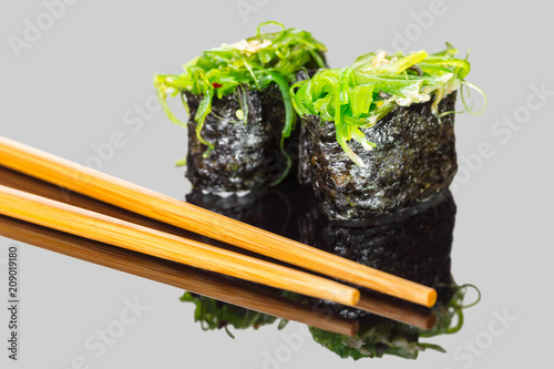 sushi gunkan with undaria and sticks