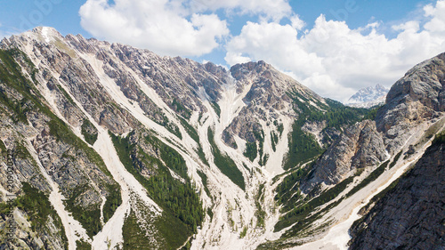 Aerial view of the mudflow with snow high in the Alpine mountains photo