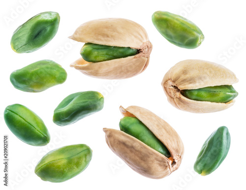 Green pistachio nuts isolated on white.