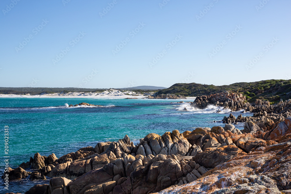 White sand and waves at The Bay of Fires, Tasmania, Australia