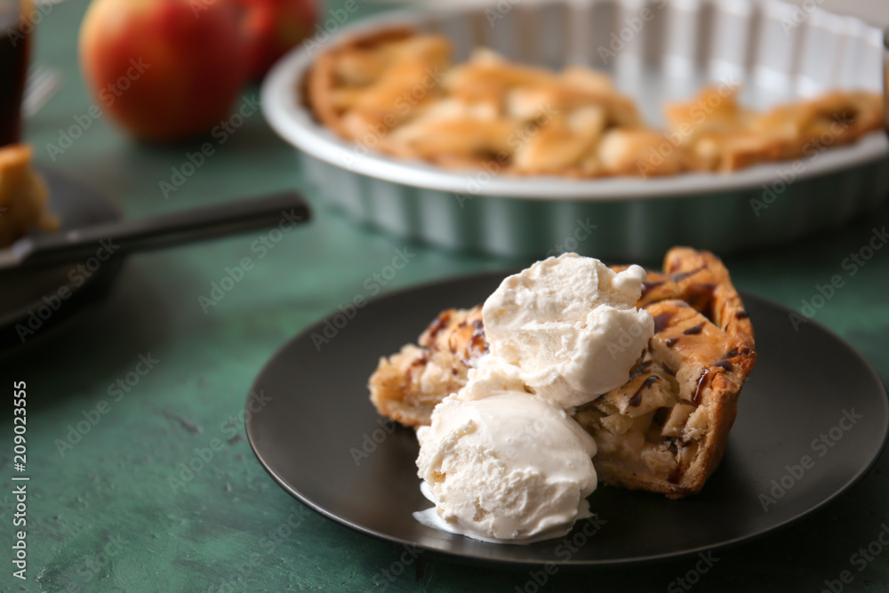 Plate with piece of tasty apple pie and ice-cream on table Plate with piece of tasty apple pie and ice-cream on table