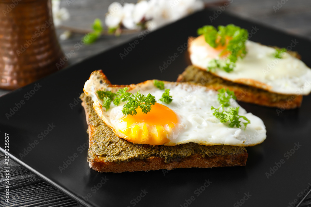 Plate with toasted bread and egg on table, closeup Plate with toasted bread and egg on table, closeup