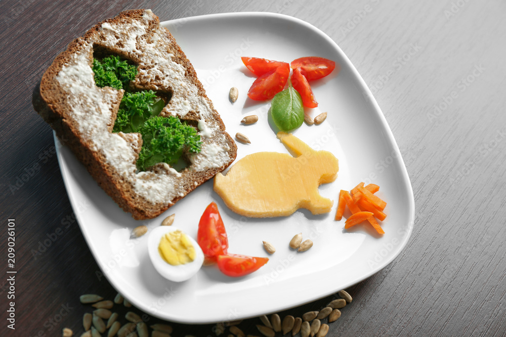 Plate with creative toast for child on table Plate with creative toast for child on table