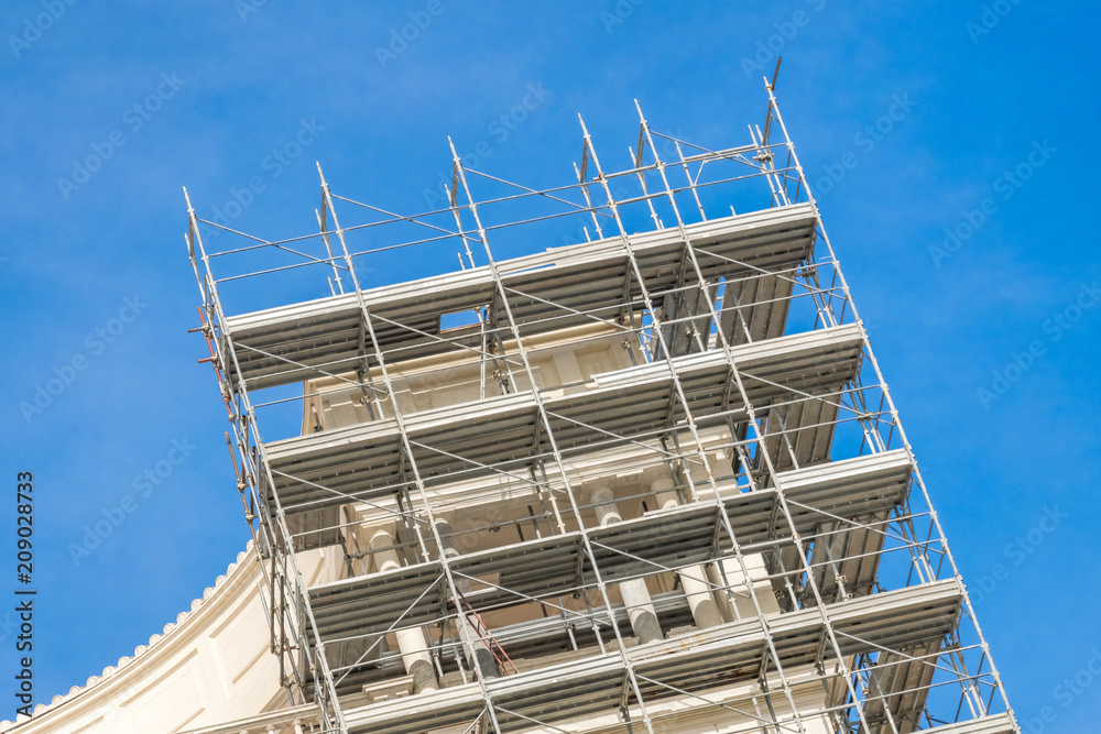 Building under construction against the blue sky