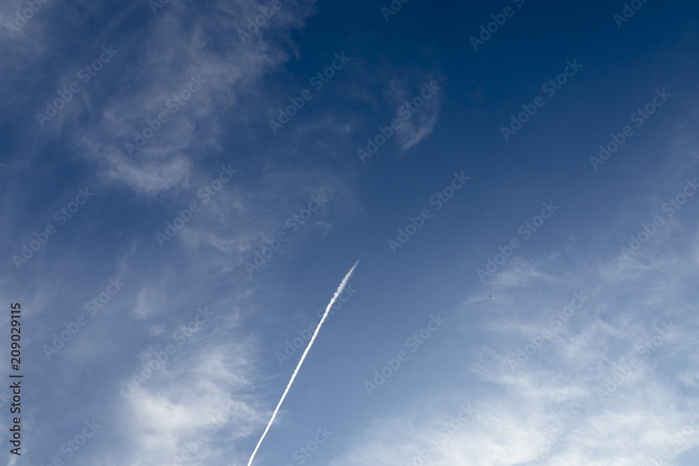 blue sky background with clouds. plane in the sky blue sky background with clouds. plane in the sky