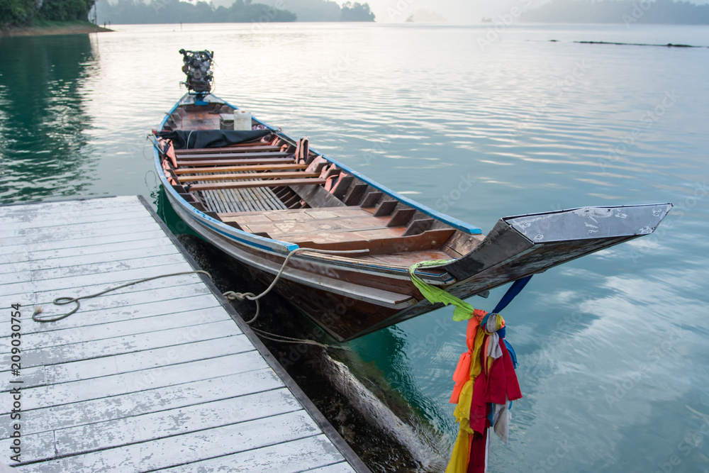 Beautiful traditional Thailand wooden boat at the pier.