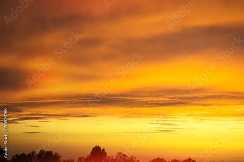 Blurred background. Bright sky with fluffy clouds.