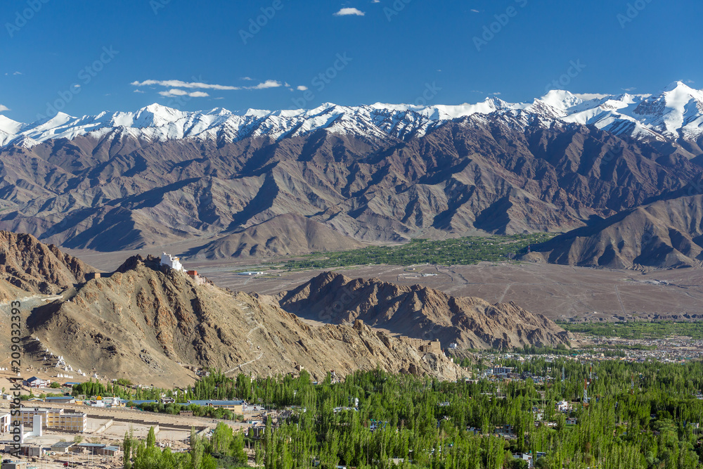 Beautiful view of Leh city with snowy Himalayas mountains on background in Ladakh, Jammu and Kashmir, India.
