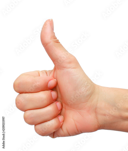 Closeup of female hand showing thumbs up sign isolated against 
