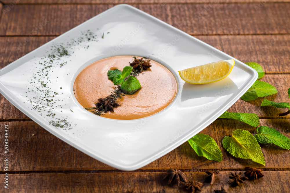 Lentils cream soup on wooden background Lentils cream soup on wooden background