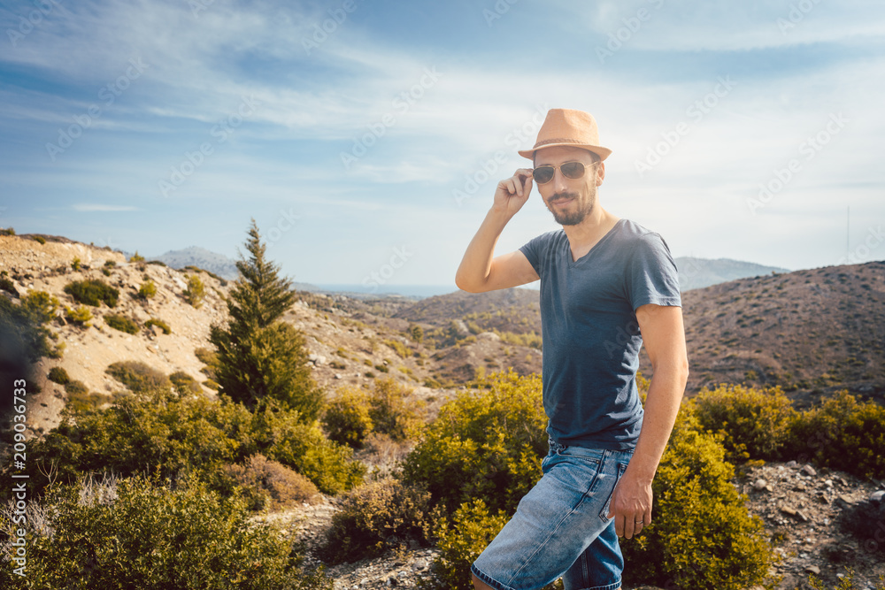 Man tourist in front of southern European landscape enjoying the view Man tourist in front of southern European landscape enjoying the view