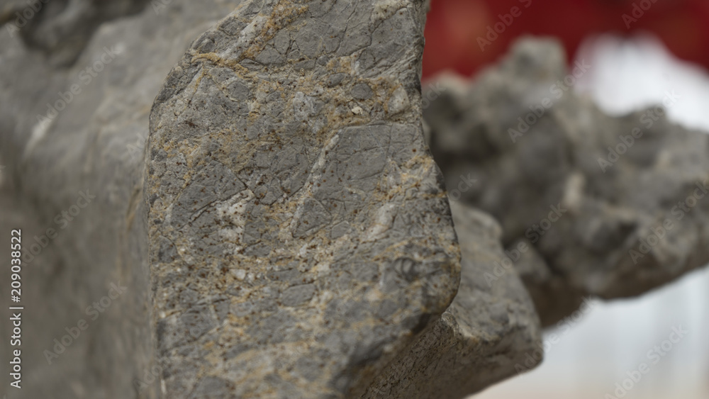 In the piece of rock, the barely visible minerals of the minerals are visible. In the piece of rock, the barely visible minerals of the minerals are visible.