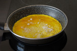 Omelette fried in a pan