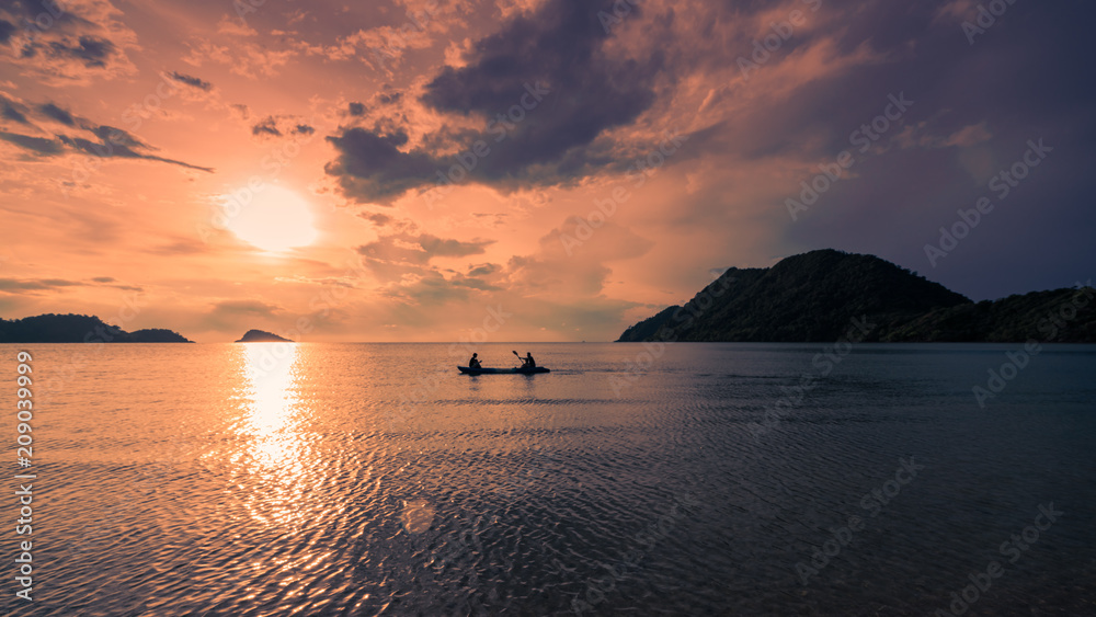 Landscape view of a boat in the sea during sunset