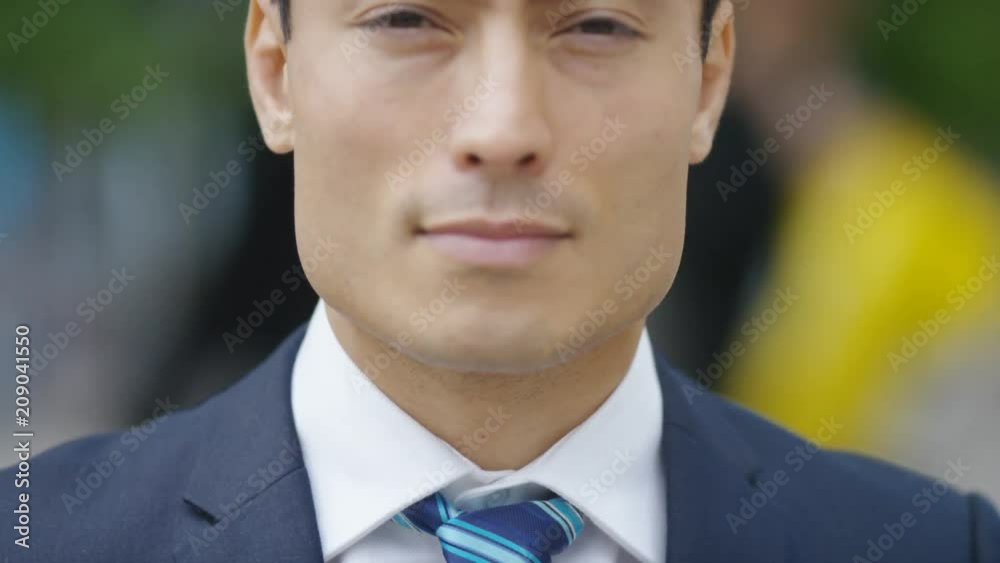 Portrait of handsome Japanese business man in a suit looking to camera Portrait of handsome Japanese business man in a suit looking to camera
