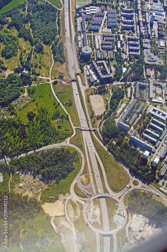 Freeway and roundabout pattern with traffic aerial