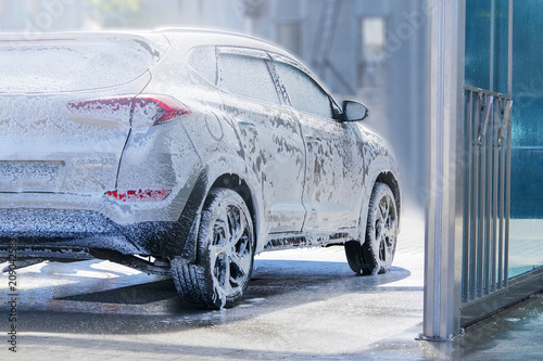 The car is serviced at the wash