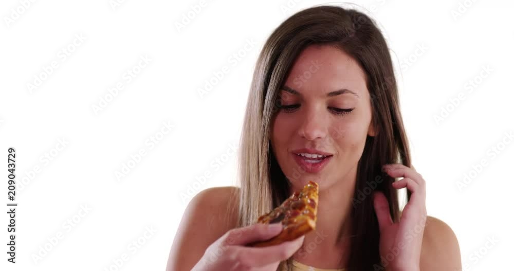 Close-up of happy woman eating pizza smiling at camera on white background, Attractive Caucasian brunette eating pizza slice happily on solid white copy space, 4k Close-up of happy woman eating pizza smiling at camera on white background, Attractive Caucasian brunette eating pizza slice happily on solid white copy space, 4k