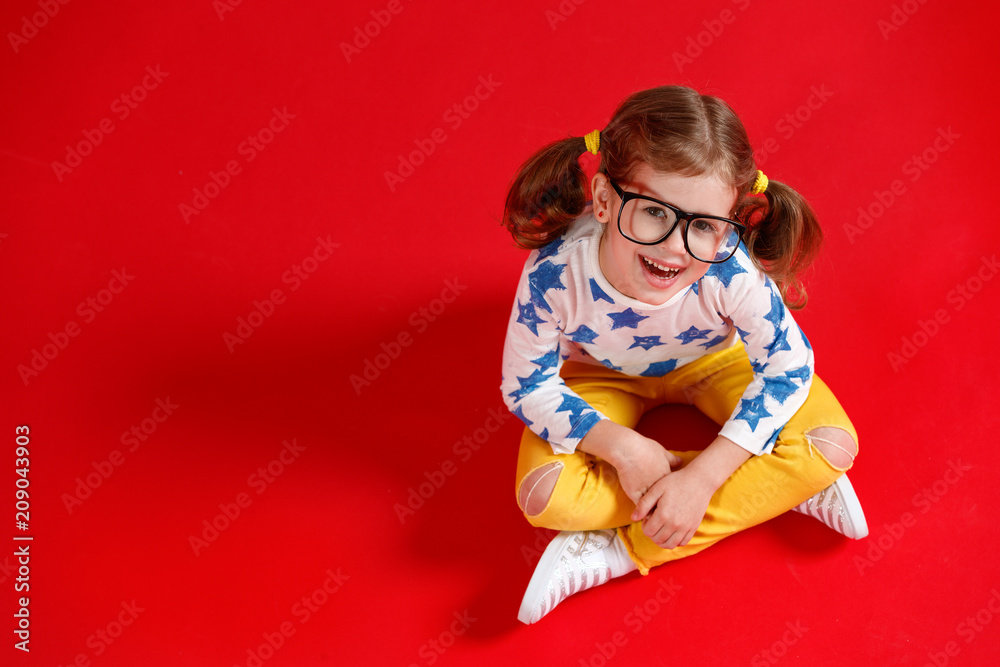 funny child girl in glasses on colored background funny child girl in glasses on colored background