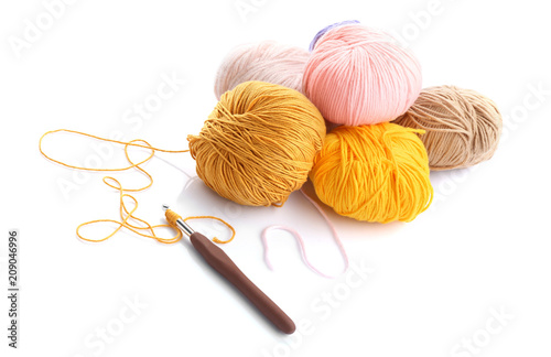 Colorful knitting yarn with crotchet on white background