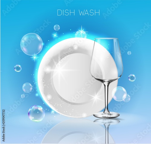 A clean plate and wine glass in soap bubbles.