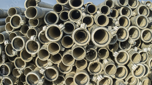 Irrigation metal pipes stacked outdoors out of watering season