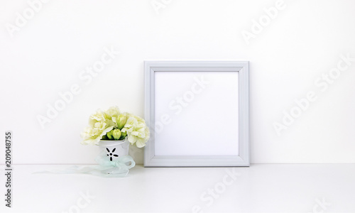 Square frame mockup with white flowers