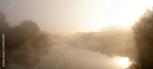 Fog on the lake. Dawn.
