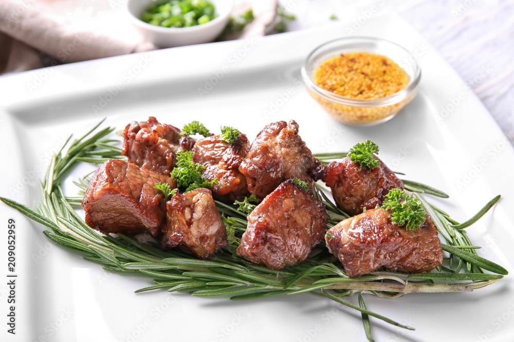 Barbecue skewers with juicy meat and herbs on plate Barbecue skewers with juicy meat and herbs on plate