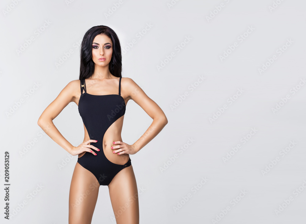 Young, fit and beautiful girl in sporty swimsuit. Sport, diet, health and beauty concept. Young, fit and beautiful girl in sporty swimsuit. Sport, diet, health and beauty concept.
