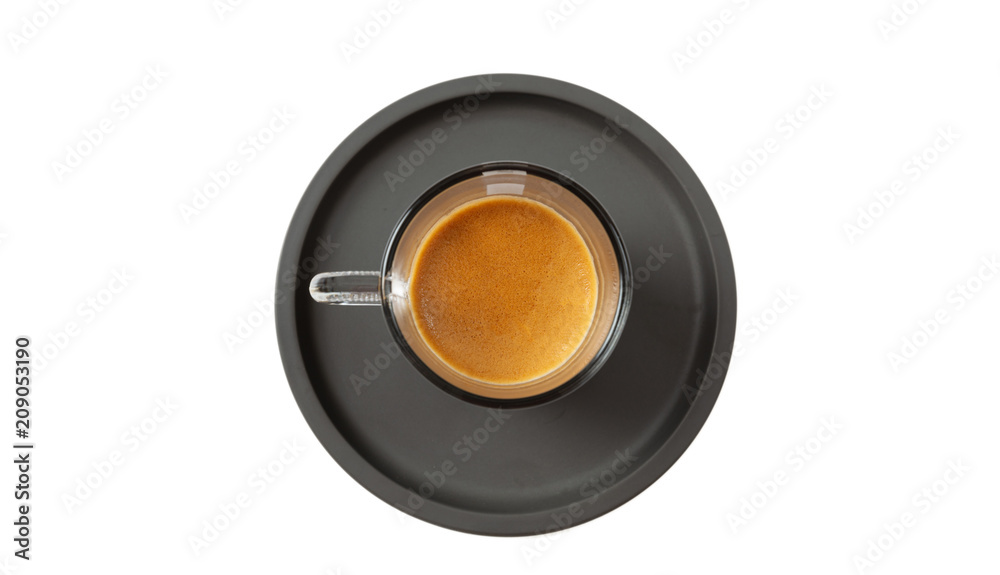 Espresso coffee on black saucer isolated on a white background, top view