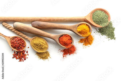 Fototapeta Naklejka Na Ścianę i Meble -  Wooden spoons with various spices on white background