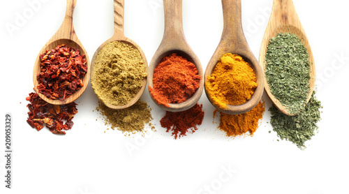 Fototapeta Naklejka Na Ścianę i Meble -  Wooden spoons with various spices on white background