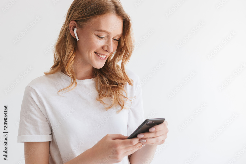 Emotional cute young redhead woman with earphones. Emotional cute young redhead woman with earphones.