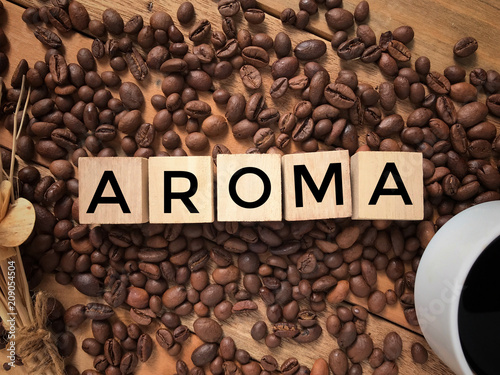 Conceptual - ‘AROMA’ written on a wooden blocks. With vintage styled background.