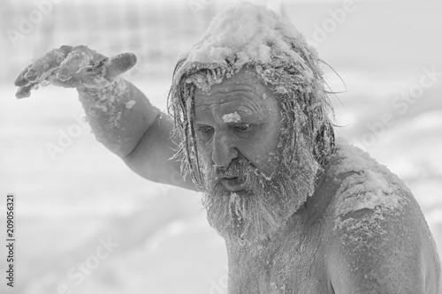 Portrait of a bearded man in the snow