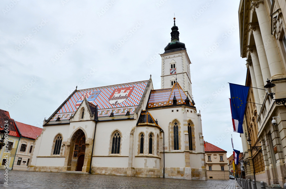 ZAGREB, CROATIA -June 9, 2016 : Church of St.Mark in St.Mark's Square in Zagreb, Croatia in a Cloudy Day ZAGREB, CROATIA -June 9, 2016 : Church of St.Mark in St.Mark's Square in Zagreb, Croatia in a Cloudy Day