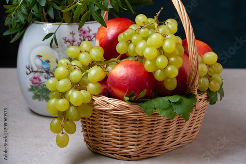 Fototapeta Naklejka Na Ścianę i Meble -  still life of grapes in a basket ripe green red natural holiday