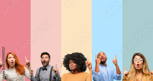 Fotografija Cool group of people, woman and man happy and surprised cheering expressing wow