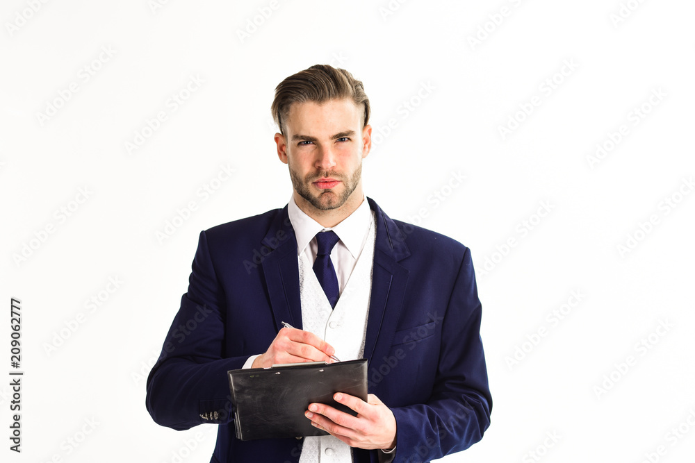 Business documents concept. Man with serious face writes on plan Business documents concept. Man with serious face writes on plan