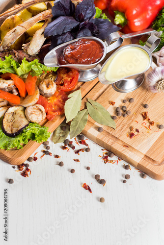 Big set of different sauces, spices and food ingredients flatlay. Top view. copy space