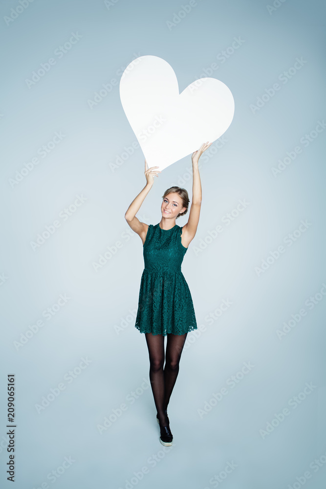 Beautiful Young Woman with White Empty Heart Banner, Love Concept Beautiful Young Woman with White Empty Heart Banner, Love Concept