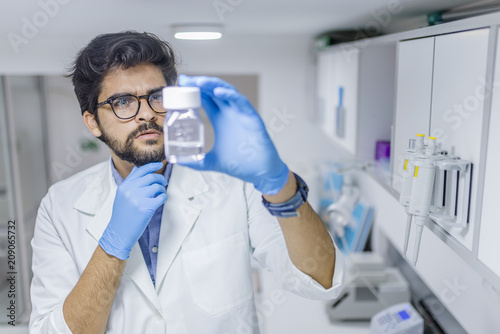 Scientist examining chemical substances in a laboratory