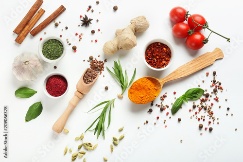 Fototapeta Naklejka Na Ścianę i Meble -  Fresh tomatoes and variety of spices on white background