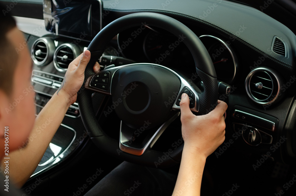 hand push Cruise control buttons on car steering