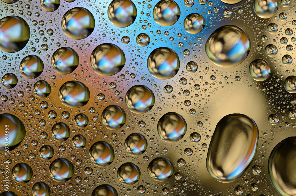Colored Water Drops on a smooth glass surface Colored Water Drops on a smooth glass surface