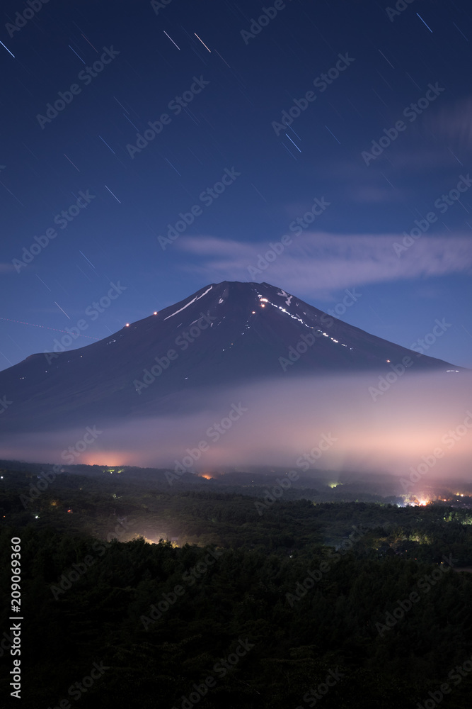 Nightscape of Mountain Fuji with cloud at Yamanaka lake